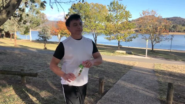 A runner notices rubbish on the ground while jogging. He picks it up and puts it the rubbish bin. Keep our environment beautiful and do the right thing, is his moto.