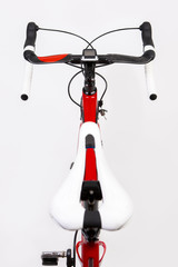 Upper View of Professional Carbon Road Bike from Saddle Perspective. Over white.