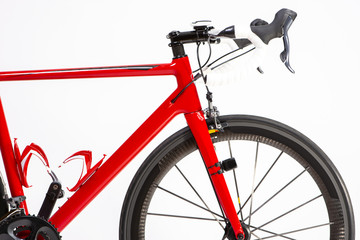 Fototapeta premium Cycling Sport Concepts. Closeup of Professional Road Bike with Deep Carbon Rims Wheelset