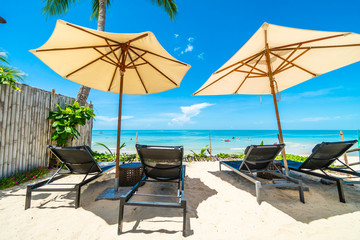 Beautiful tropical beach and sea with chair on blue sky