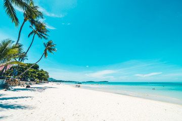 Obraz na płótnie Canvas Beautiful tropical beach and sea with chair on blue sky