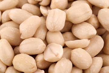 Fototapeta na wymiar Peeled peanuts texture background, copy space. Abstract background. Peanut, groundnut, goober, earth-nut. Food photography. Top view, flat lay. Nuts pattern