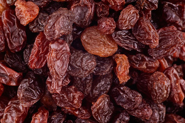 Raisins background texture, copy space. Dried grape texture. Delicious background or wallpaper. Abstract food textures. Healthy food organic nutrition. Top view, flat lay