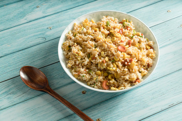 Egg Fried rice with a blue wood grain background