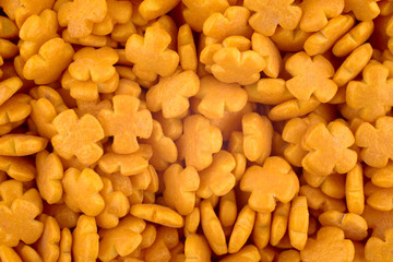 Orange candy background, copy space. Closeup of pile pastel candies. Candy texture. Candy pattern. Sweets background. Abstract background. Top view, flat lay