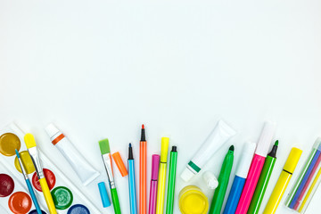 back to school concept. variety of bright kids stationary on white background
