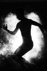 Silhouette of Attractive Body Shape with Fluttering Curl Hair in Smoke