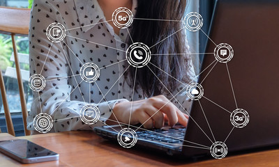 Hand of businesswoman using laptop.