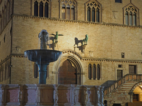 Perugia, Italy. Views of the Palazzo dei Priori an historical building of the town and the Fontana Maggiore a monumental medieval fountain