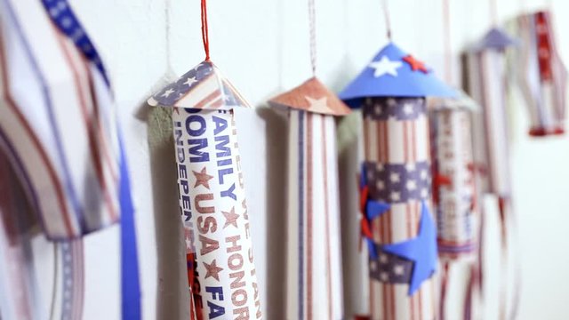 Paper firecrackers made from red, white and blue paper for July 4th celebration