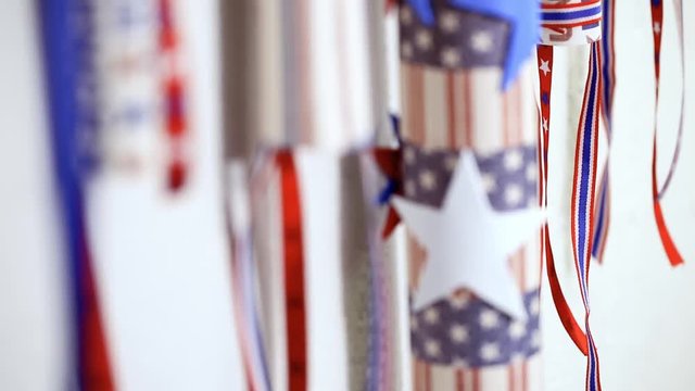 Paper firecrackers made from red, white and blue paper for July 4th celebration