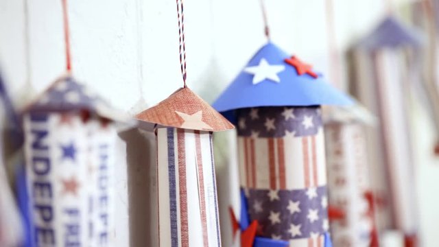 Paper firecrackers made from red, white and blue paper for July 4th celebration