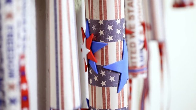 Paper firecrackers made from red, white and blue paper for July 4th celebration