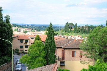 Beautiful landscape of hills, cypress trees and houses in Tuscany, Italy