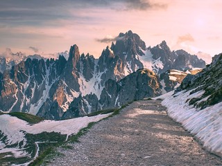 Tre Cime di Lavaredo in sunny April evening, view from tour
