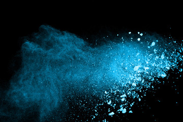 The explosion and splash of color powder. Abstract color powder explosion on black background....