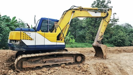 backhoe to excavate the soil on the ground.construction site excavator.wheel loader.
