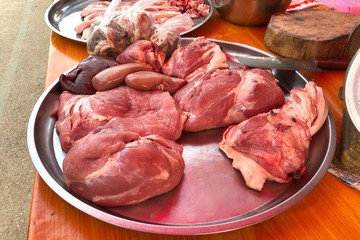 Part of pork on the tray for sale in local market in Pai, Thailand