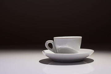 Profile of coffee cup on white and black background