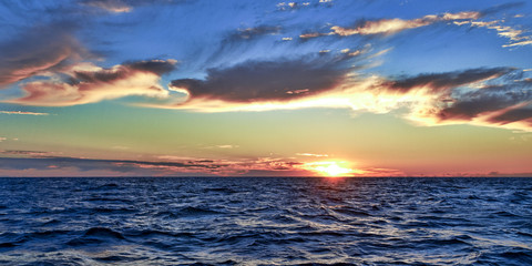 Naklejka na ściany i meble Golden colored blue Sky Sunrise Seascape. Australia