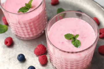 Delicious smoothie with raspberries in glasses, closeup