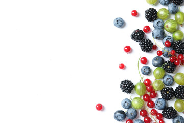 Mix of different fresh berries on white background