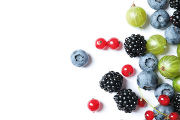 Mix of different fresh berries on white background