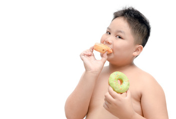 Obese fat boy is eating donut isolated