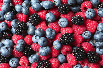 Raspberries, blackberries and blueberries as background