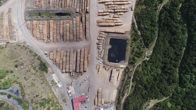 Aerial shot of sawmill. Wood pile in a lumber yard - New Zealand