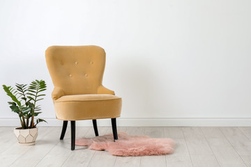Elegant room interior with stylish comfortable armchair