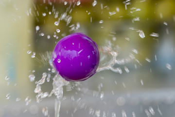 ball suspended on the water