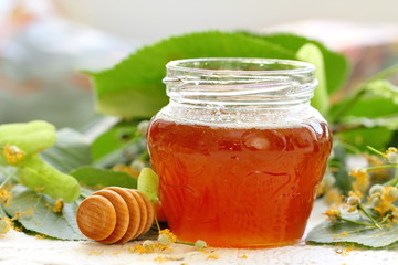 Linden honey in glass jar