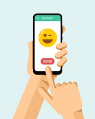 Hand holds the smartphone with funny smile icon on the screen. Flat vector modern phone mock-up illustration