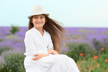 child girl is in the lavender field, beautiful portrait, face closeup, summer landscape