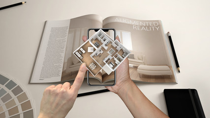 Augmented reality concept. Hand holding smartphone with AR application used to simulate 3d pop-up...