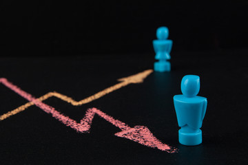 Gender wage gap and equality concept  - line graph hand drawn with chalk on blackbloard with male...