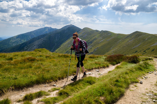 Walking woman hiking on the mountains