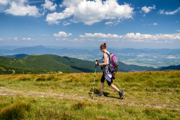 Walking woman hiking on the mountains