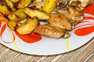 chicken wings with potatoes in the oven