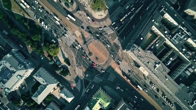 Aerial top down time lapse of city roundabout traffic