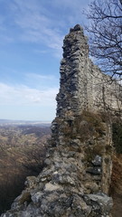Front wall ruins of old castle Okic, Croatia with scenic view of wally full of houses and clear blue sky