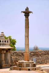A view of Brahmasthambha, on Chandragiri hill, Sravanabelgola, Karnataka. A seated figure of Lord Brahma sits at the top.
