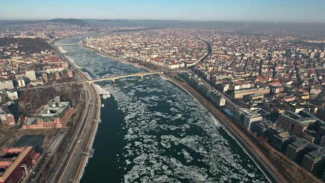 Aerial view of Budapest in winter, drifting ice on Danube river - Hungary