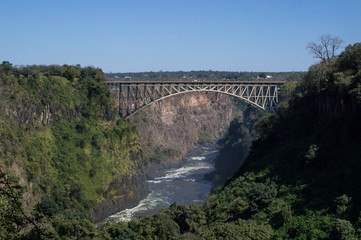 Fototapeta na wymiar Victoria Falls Bridge between Zambia and Zimbabwe Seen from the Zambian Side