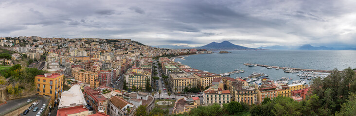 Fototapeta na wymiar Panorama of Naples, view of the port in the Gulf of Naples and Mount Vesuvius. The province of Campania. Italy. Cloudy day