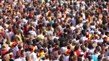 people watching soccer at public viewing in Germany with blurr effect