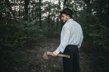 Serial murderer with an axe, bloody maniac