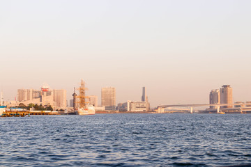 One boat and rainbow bridge at sumida river viewpoint in tokyo,Japan