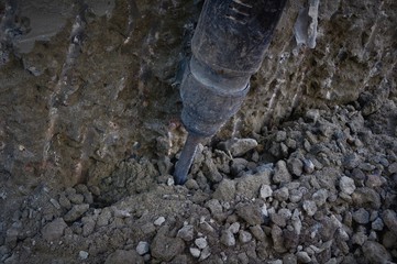 Perforator for concrete.Perforator machine for concrete in the hands of the master. cement drilling